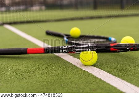 Tennis Court Top View Tennis Balls And Racket On The Green Grass Background