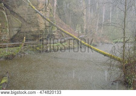 Peklo, Czechia - March 25, 2023: Spring Pouring Rain By Robecsky Potok Stream