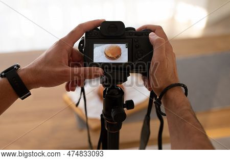 Unrecognizable Man Taking Photo Of Humburger, Using Digital Camera