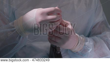 A Veterinary Surgeon In The Operating Room Inserts A Drill Into A Medical Drill And Prepares For Ost