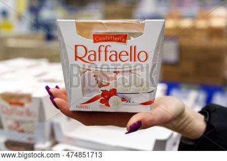 Tyumen, Russia-january 26, 2023: Raffaello In Hand. Raffaello Is A Spherical Coconut Almond Confecti