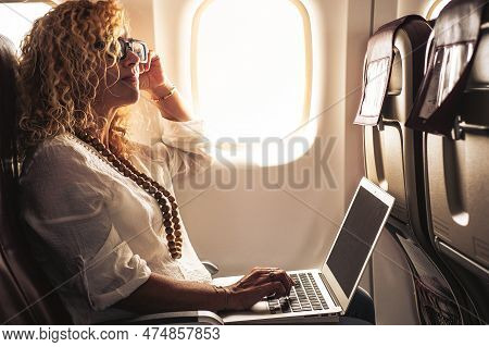 Trendy Modern Businesswoman Travel Alone With Aircraft And Use Laptop With Online Wireless Connectio