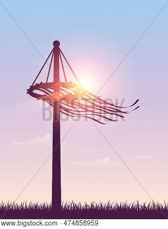 Maypole With Ribbons On Meadow Silhouette On Sunny Background