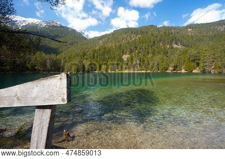 Intact Naru At Pristine Mountain Lake In Tyrol Landscape Shot Wooden Fence Blue Sky Partly Cloudy Fo