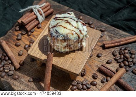 Chocobon (soft Chocolate Bun) Topped With Rich Cream Cheese Frosting And Cinnamon With Coffee Beans 