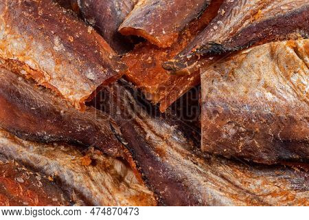 Pieces Of Cleaned Dried Fishbackground. Dry Peppered Pollack. Amber With Pepper Collection.