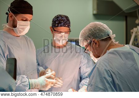 Surgeon Face In Operating Room, Stressful Operation, Surgeon Performs Operation In Modern Operating 