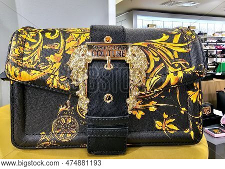 Latvia, Riga, April, 2023 - Versace Jeans Couture Handbag With Golden Design In Stockmann Shopping M