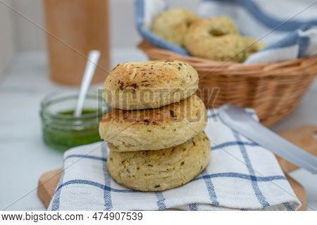 Home Made Whole Grain Bagels With Wild Garic On A Table