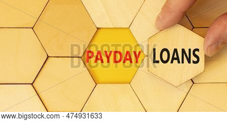 Payday Loans Symbol. Concept Words Payday Loans Typed On Wooden Puzzles. Beautiful Yellow Table Yell