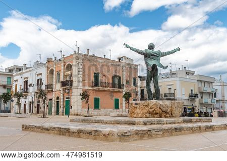 Polignano A Mare, Bari, Italy - April 6 2023: Bronze Statue Of The Italian Singer Domenico Modugno F
