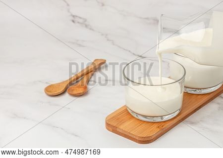 Lactose Free Yogurt, Kefir, Fermented Milk On A Light Background. Healthy, Clean Eating. Vegan Or Gl