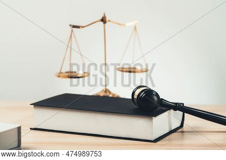 Symbolizing Justice And Legal Authority, Golden Balanced Scale And Gavel On Desk With Law Book In La