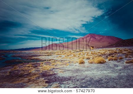 Desert And Mountain Over Blue Sky And White Clouds On Altiplano,bolivia