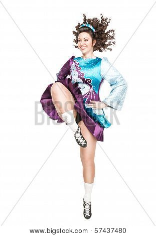 Young Woman In Irish Dance Dress Dancing Isolated