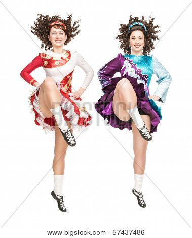 Two Young Women In Irish Dance Dress Dancing Isolated