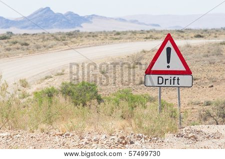Drift Warning Sign At A Gravel Road