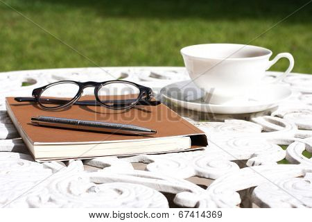 Coffee Notebook Graden Table And Glasses