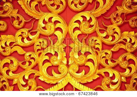 Wood Curving On Red Background.