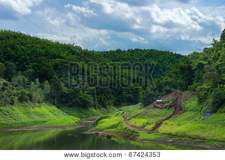 Urban River Surround With Forrest And Cloud