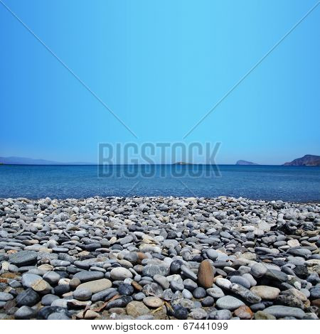 Beach with pebbles and blue sea Sitia Crete 