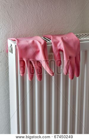 Rubber gloves on a radiator