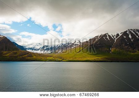 Mighty fjords with mountains covered by snow near Olafsfjordur, Northern Iceland
