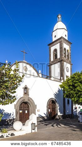 The Beautiful Church Of San Gines In Arrecife With Its White-washed Exterior And Attractive Bell Tow