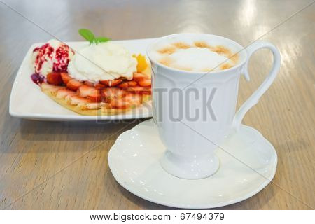 Cappuccino Coffee Cup And Vanilla Ice Cream With Strawberry And Whipp Cream In Background