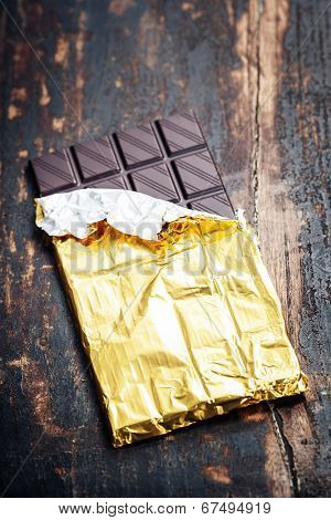 Closeup of  Dark Chocolate on wooden board