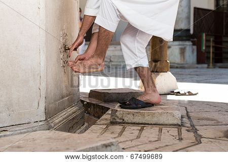 Muslim Washing Feet Before Entering Mosque