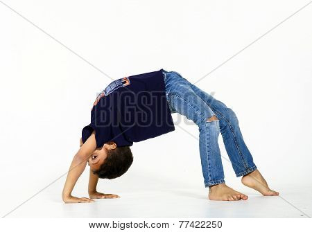 Young Active Afro-american Boy Doing Gymnastics