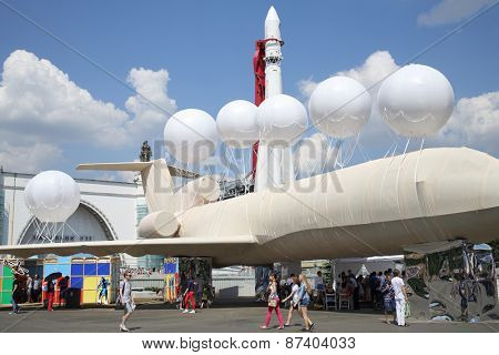 MOSCOW - MAY 24, 2014: Exhibits rocket and the plane decorated with balloons at the Festival Polytech in the city park of All-Russian Exhibition Center in Moscow