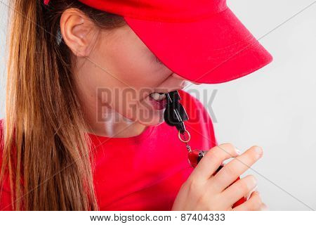 Lifeguard On Duty Blowing A Whistle