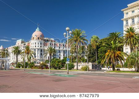 NICE, FRANCE - OCTOBER 2, 2014: View of English promenade (Promenade des Anglais) with Hotel Negresco, one of the famous landmarks of the city.