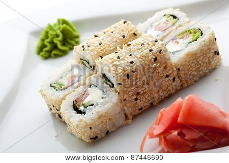 Maki Sushi - Roll made of Smoked Salmon, Cream Cheese, Cucumber and Spring Onion inside. Sesame ouside