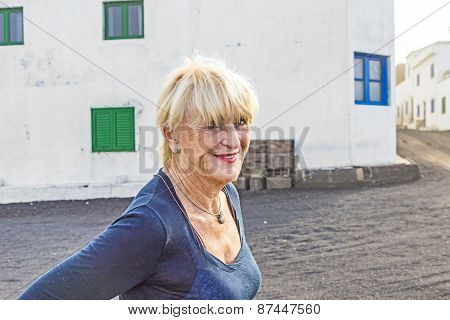 Happy Attractive Senior Woman In Landscape