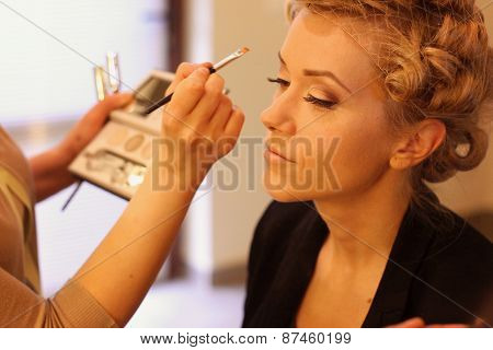 Stylist Applying Make Up For Bride On The Wedding Day