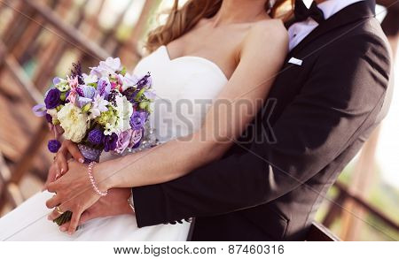 Bride And Groom On A Bridge