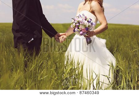 Bride And Groom Having Fun On The Fields