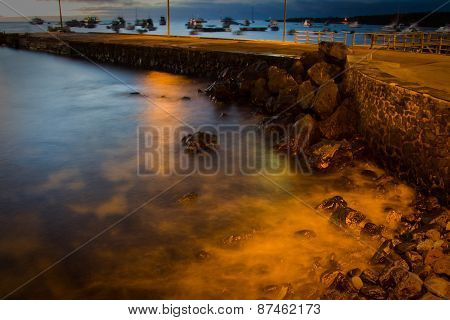 View of pier in San Cristobal island, Galapagos, during sunset