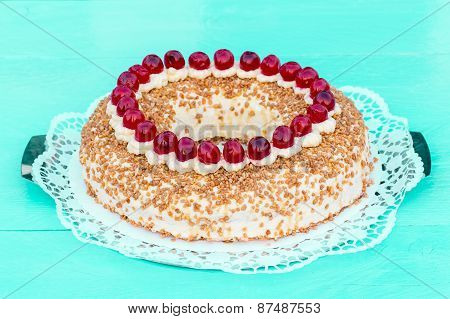 Frankfurt Crown Cake With Cherries On A Turquoise Wood
