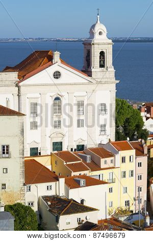 Alfama downtown and Santo Estevao Church in Lisbon, Portugal.