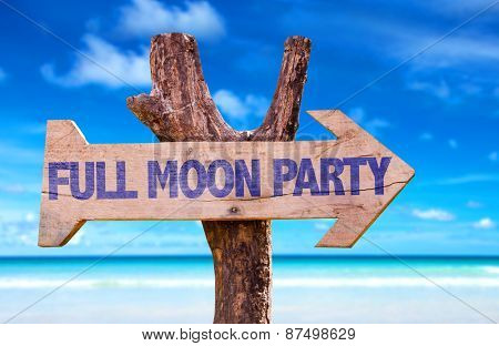 Full Moon Party wooden sign with beach background