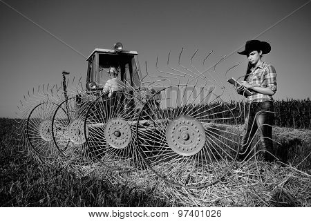Woman Looking At Haying Rake