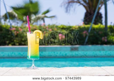 Glass Of Happy Days Cocktail Near The Pool