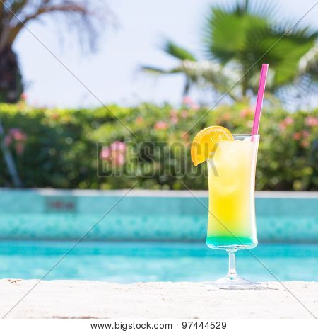 Glass Of Happy Days Cocktail Near The Pool