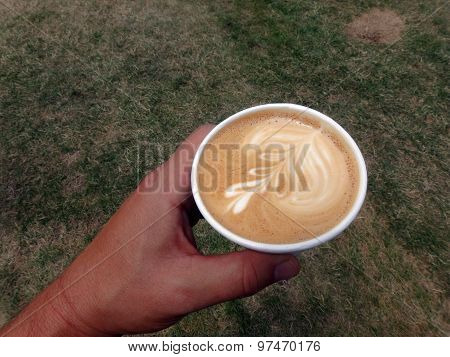 Holding A Styrofoam Cup Of Cappuccino