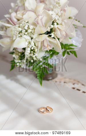 Bouquet Of Beautiful Flowers In Vase And Engagement Rings
