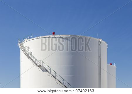 White Tanks In Tank Farm With Iron Staircase